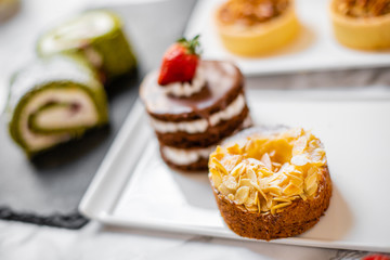 delicious strawberry and mint cakes on a white and black plate