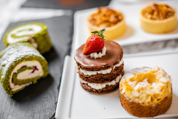 delicious strawberry and mint cakes on a white and black plate