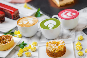 delicious composition of latte tea with cakes