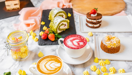 delicious composition of latte tea with cakes