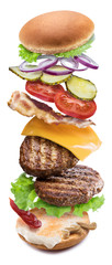 Hamburger ingredients falling down one by one to create a perfect meal. Colorful conceptual picture of burger cooking. Clipping path.
