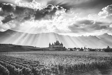Black and white photography of Aigle Castle and Alps in Switzerland