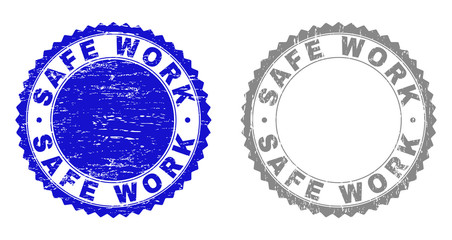 Grunge SAFE WORK stamp seals isolated on a white background. Rosette seals with grunge texture in blue and grey colors. Vector rubber stamp imitation of SAFE WORK label inside round rosette.