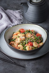 Noodles with shrimps and vegetables, Asian cuisine, Glass chinese noodles, Gray background, Selective focus