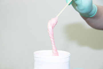 Sugar paste for depilation. Shugaring in the spa salon. Beauty and health of women. Women things.