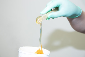 Sugar paste for depilation. Shugaring in the spa salon. Beauty and health of women. Women things.