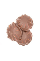 Marshmallows in chocolate. The isolated image on the white background.