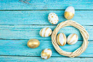 Fototapeta na wymiar Happy Easter. eggs isolated on wooden table background.. Balls, wreath woven from the vines. Copy space for text. Top view.