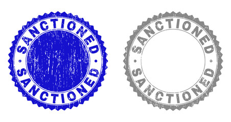 Grunge SANCTIONED stamp seals isolated on a white background. Rosette seals with grunge texture in blue and gray colors. Vector rubber stamp imitation of SANCTIONED text inside round rosette.