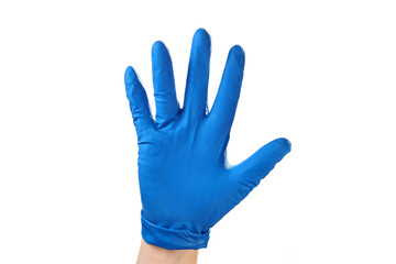 Hand in blue rubber glove showing gesture symbol, on white isolate.