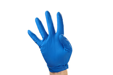 Hand in blue rubber glove showing gesture symbol, on white isolate.