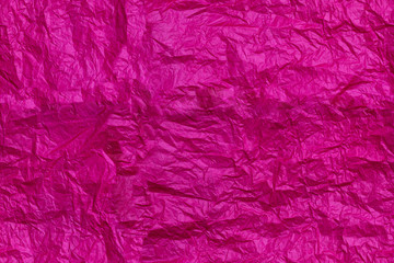 Fototapeta premium Seamless pattern. Pink tissue paper, texture and backgrounds. Bright crimson background - crumpled paper. A place for your inscription, flat lay
