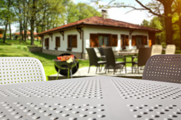 White table background of free space and grill time in garden 