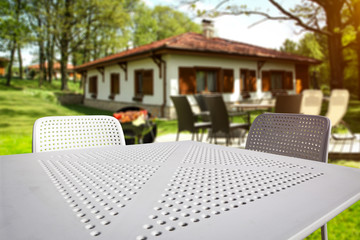 White table background of free space and grill time in garden 
