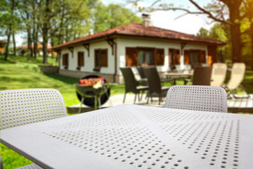 White table background of free space and grill time in garden 
