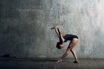 Ballerina female. Young beautiful woman ballet dancer, dressed in professional outfit, pointe shoes...
