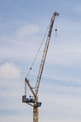 Crane on background of blue sky