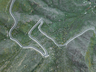 Aerial view of a road crossing a forest