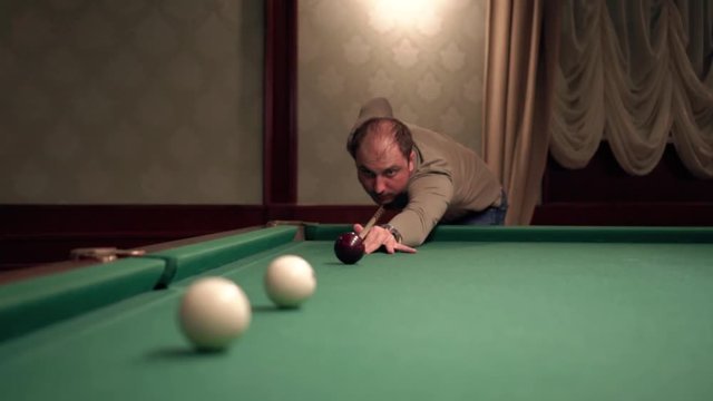 man playing billiards