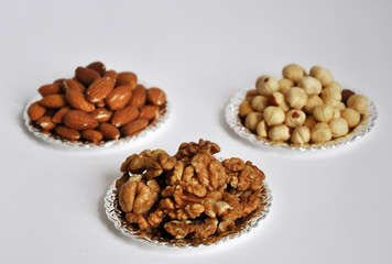 mixed nuts in a bowl isolated on white background