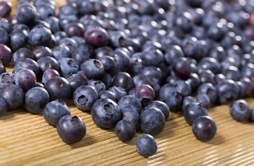 Fresh delicious blueberries on wooden table