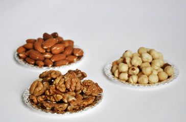 mixed nuts in a bowl isolated on white background