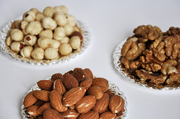 mixed nuts in a bowl isolated on white background