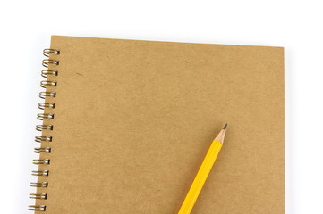 Recycled blank notebook front cover with pencil isolated on white background.