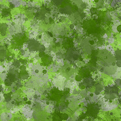 Green paint splatter effect texture on gray paper background. Artistic backdrop. Different paint drops. 