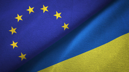 European Union and Ukraine two flags textile cloth, fabric texture © Aleks Taurus