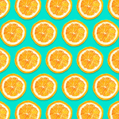 Dry orange slices pattern design. Cut fruit section isolated on blue background.
