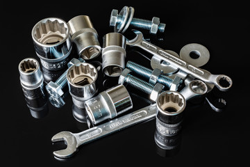 Screws, washers, nuts, keys for loosening and tightening