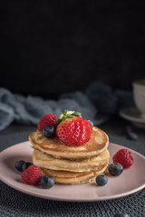 Delicious american pancakes with berries. Vertical. Copyspace