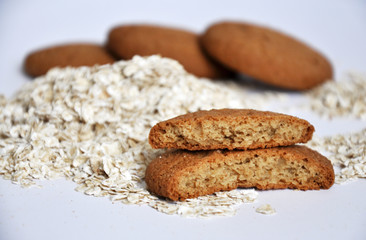 oatmeal cookies and oats on white background