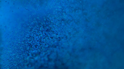 Blue Particles with Depth of Filed. Realistic 3D Illustration.