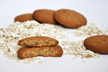 oatmeal cookies and oats on white background