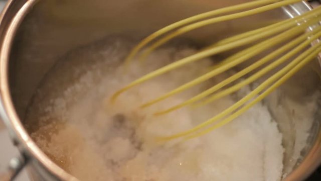 Sugar syrup with agar-agar boils in a saucepan for cooking marshmallows. Homemade