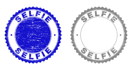 Obraz premium Grunge SELFIE stamp seals isolated on a white background. Rosette seals with grunge texture in blue and grey colors. Vector rubber stamp imitation of SELFIE text inside round rosette.