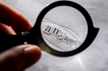 get an answer.Answer to the question.Word answer composed of paper letters through a magnifying glass