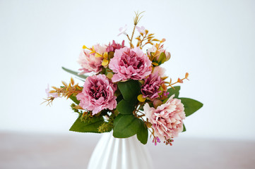 bouquet in a vase light background