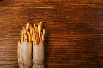 bread sticks o black wood background 