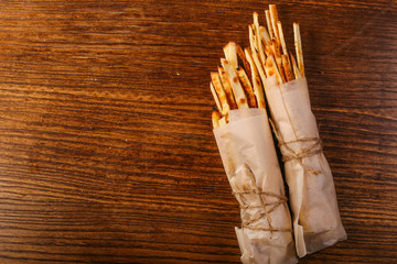 bread sticks o black wood background 