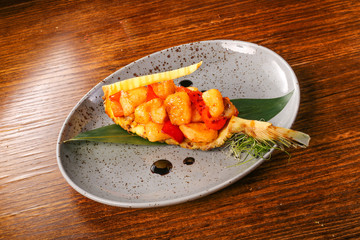 hot salad on black wood background 