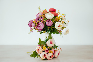 bouquet in a vase light background