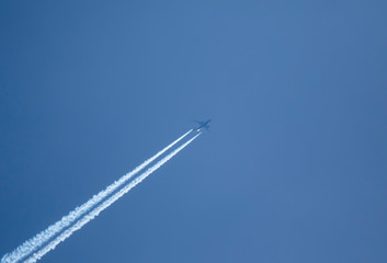 Airplane leaving trails in the sky