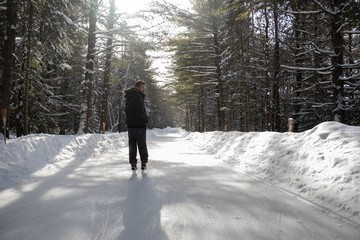 Man enjoying a skate at Arrowhead Park forest trail