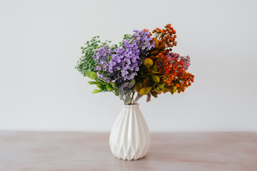 bouquet in a vase light background