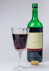 glass and bottle of wine isolated on white