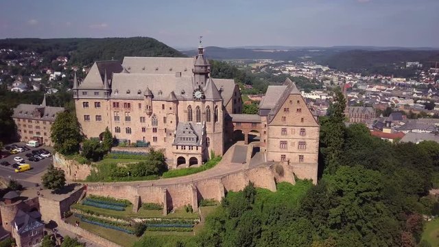 Aerial View Marburg Medieval Castle Germany on a Hill Camera Turning Around Town Behind Wide Shot