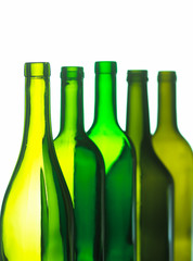 GROUP OF FIVE GREEN WINE BOTTLES ON WHITE BACKGROUND
